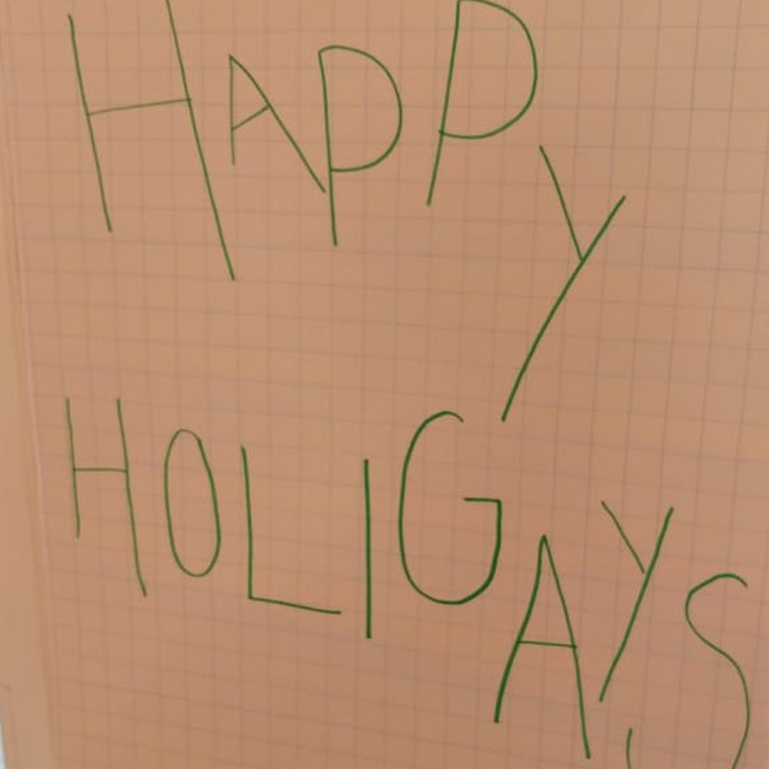 a sign with the text "Happy Holigays"